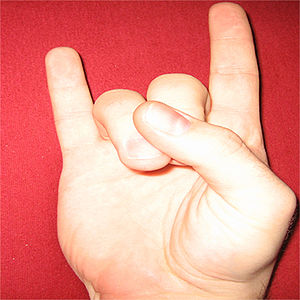 The "devil's horns" symbol that Dio ...